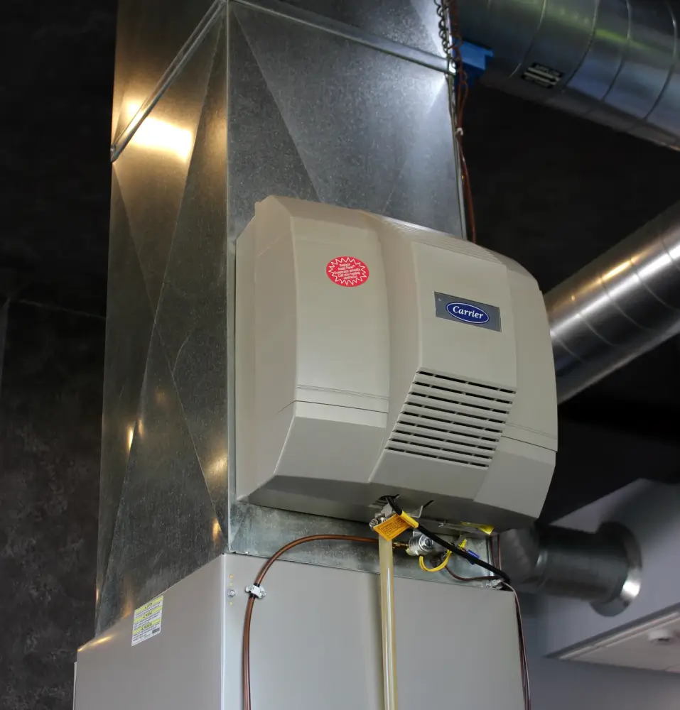 Whole-Home Humidifier Installation by K Komfort Carrier whole-home humidifier professionally installed on a heating ventilation and air conditioning HVAC duct system by K Komfort in Milwaukee Wisconsin.