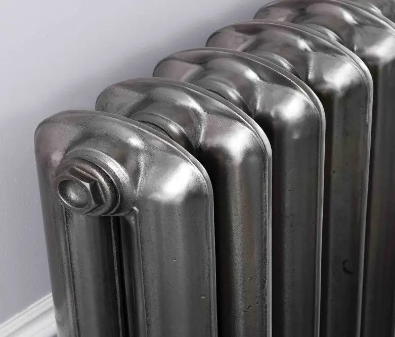 Close up of a classic cast iron home heating radiator representing residential boiler repair and hydronic heating service by K Komfort.