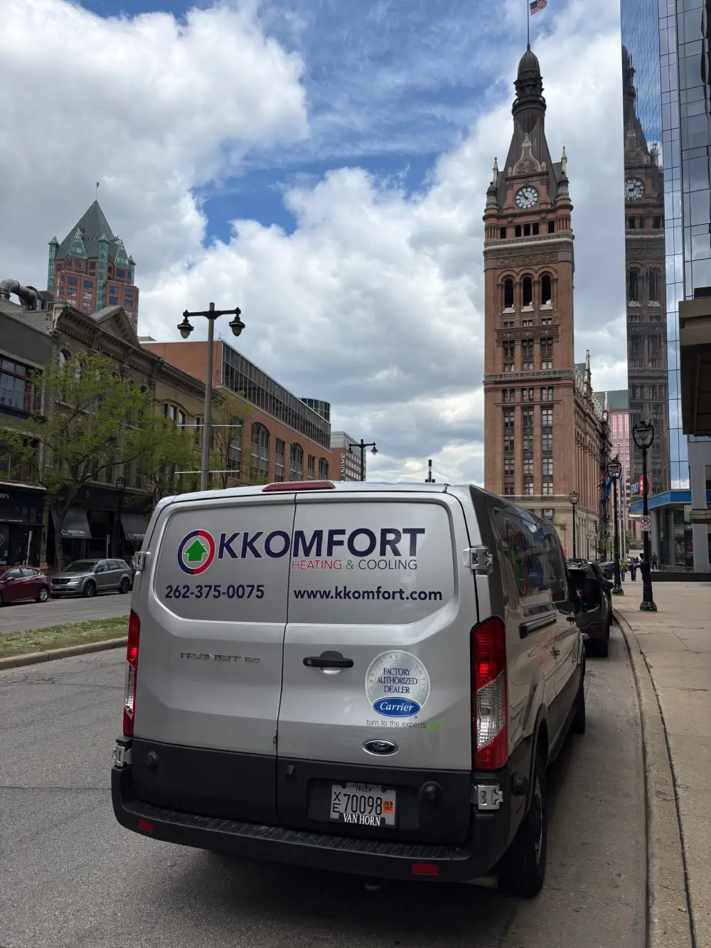 K Komfort Local HVAC Repair Milwaukee K Komfort Heating and Cooling service van parked in downtown Milwaukee near City Hall providing emergency local HVAC repair services.