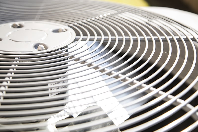 Top view of an air conditioner unit outdoors in hot summer season.
