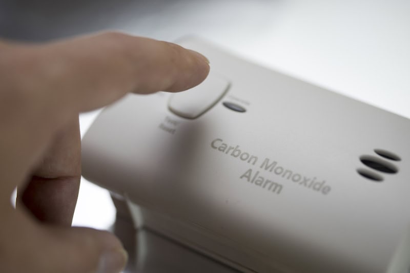 What to Know About Carbon Monoxide Poisoning. Studio shot of carbon monoxide detector.