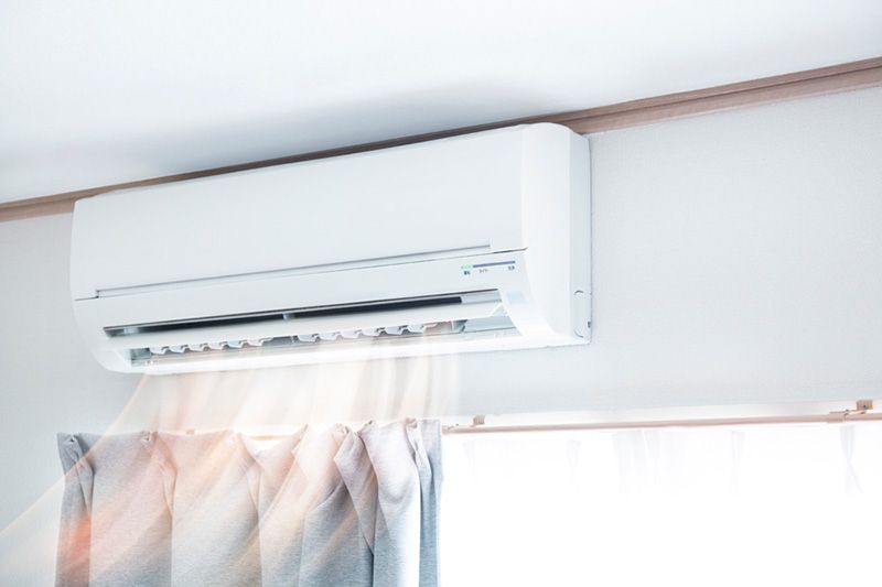 Image of a ductless system blowing air. Why Ductless Is the Way to Go.